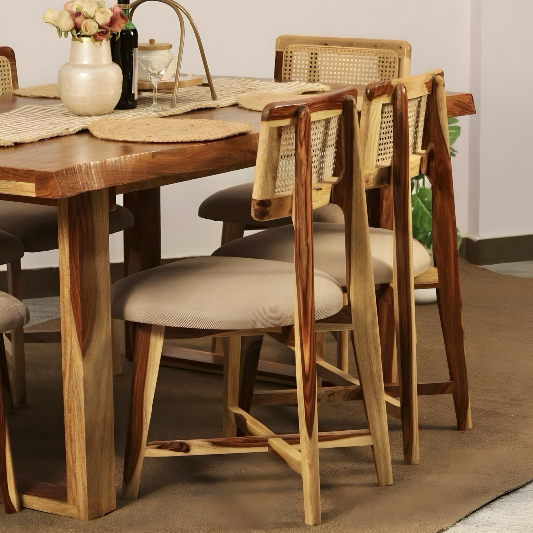 Elevate your dining experience with our sheesham wood live edge dining table paired with stylish and durable cane chairs. Buy near you in Bangalore today